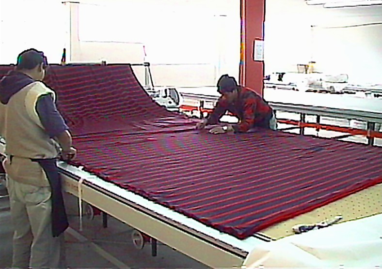 Spreading knitted fabric on VEITH Pin Table